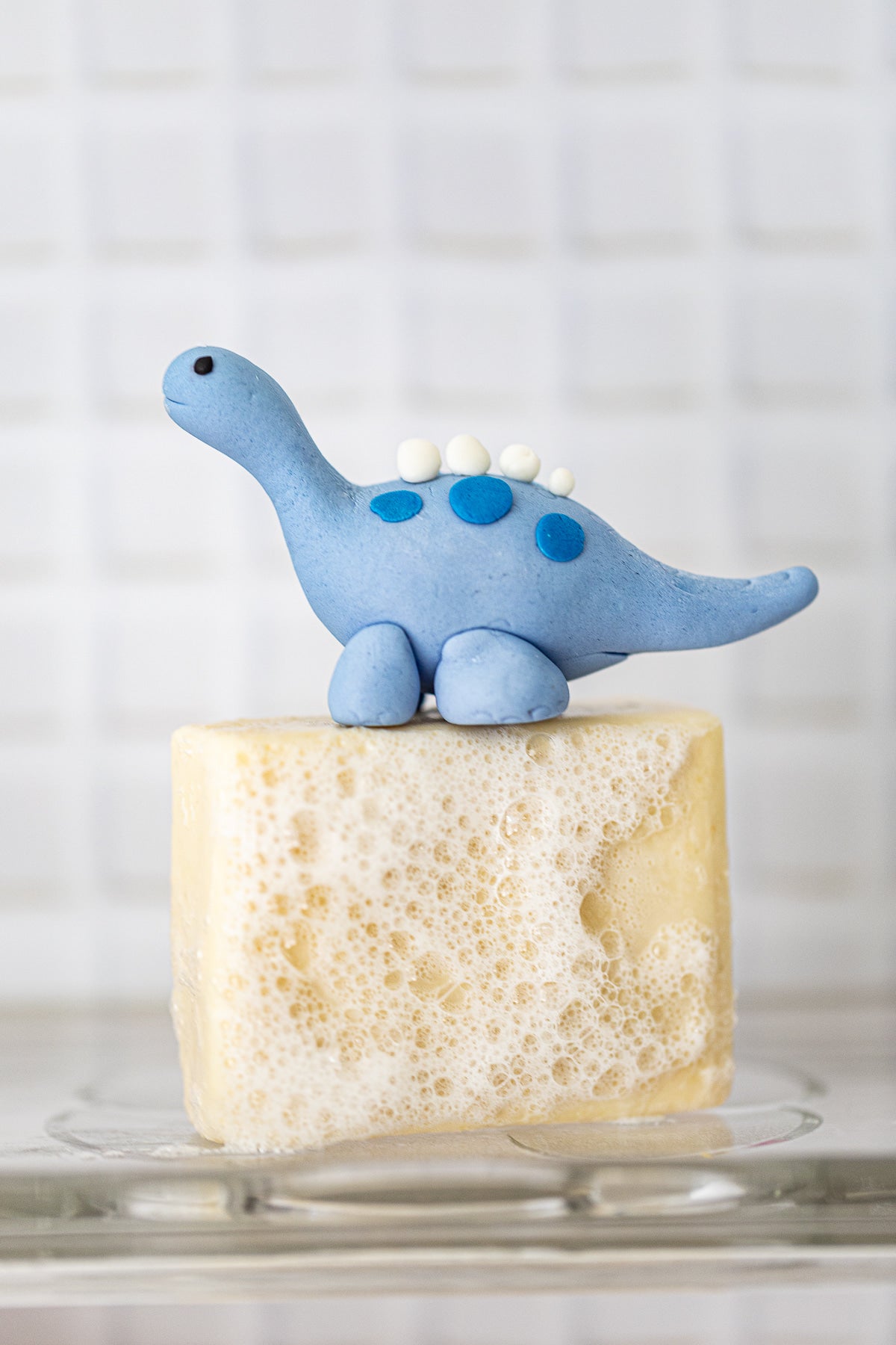 The OG clean skincare soap lathered with blue dino